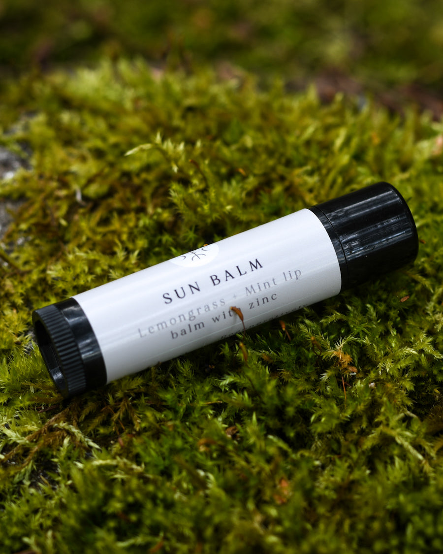 Sun Balm with Lemongrass & Mint resting in moss