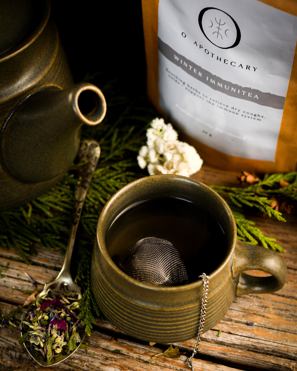 Kettle and tea cup photo with Winter Immune Tea