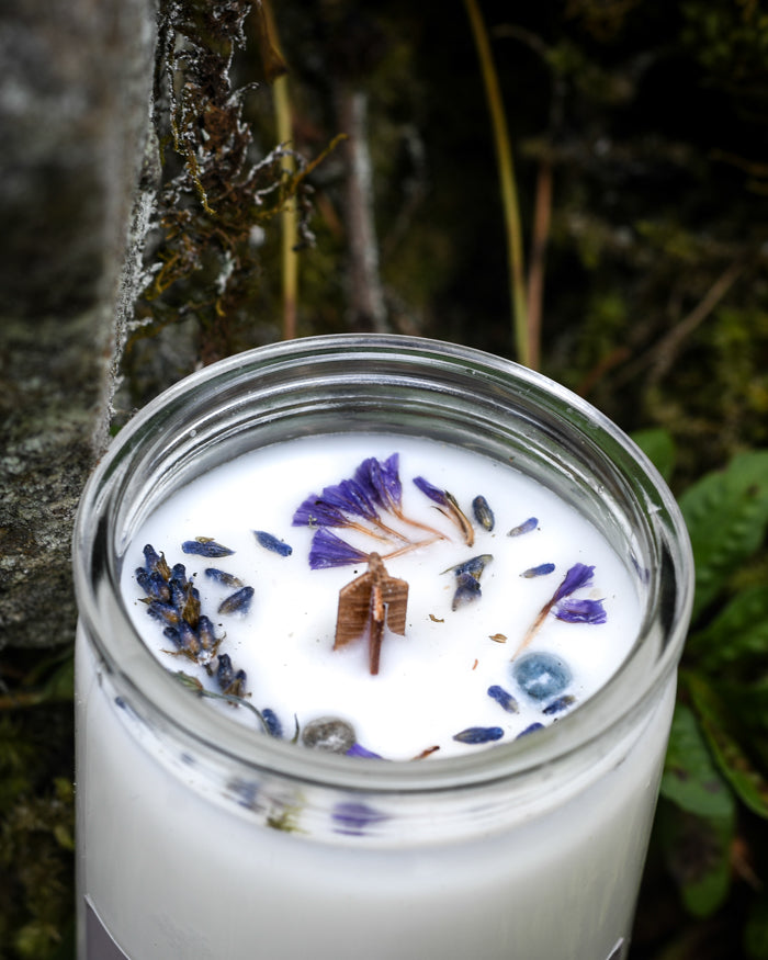 Top view of a Healing ritual candle with lavender flower petals & labradorite